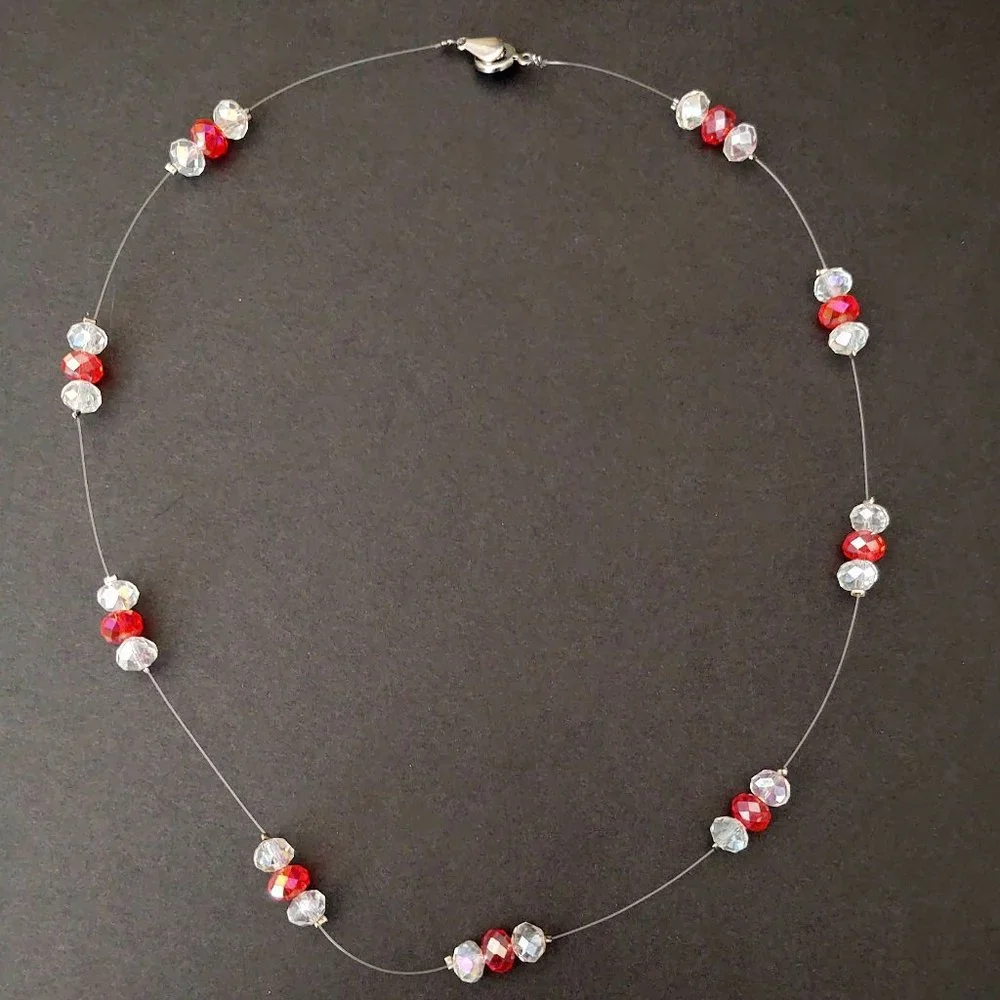 Floating clear and orange crystal necklace